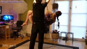 Submissive girl in rope bondage and suspension