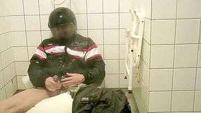 SHOWERING IN BOMBER HELMET AND PVC JACKET