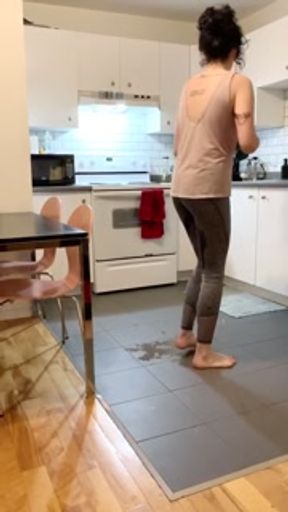 Casually wetting in the kitchen