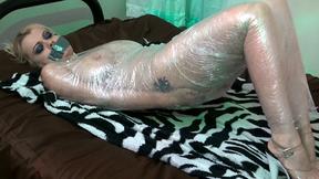 ”Blonde babe Nadia White wrapped up in plastic”
