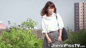 Japanese lady finds a secluded place to pee in public space