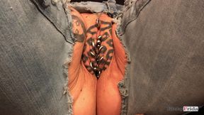 KinkyFrida in jeans is playing with her pierced and tattooed pussy