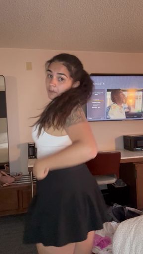 Woman in black skirt dancing