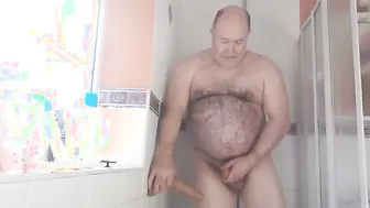Bear uses a dildo to masturbate on the couch and in the bathroom