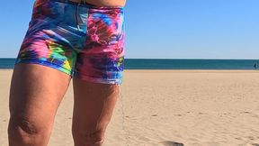 Watch me wet myself standing on the beach. Piss leaks out of my swimsuit and runs down my legs onto the sand. Wet!