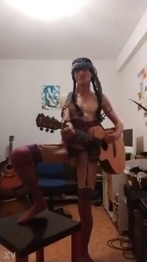 In a garter bodysuit... I exibe and sing sex on the guitar, in the style of a horny little naughty slut...!! ...