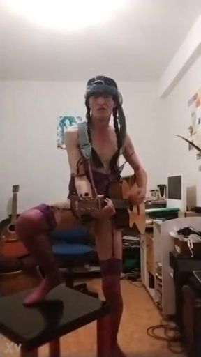 In a garter bodysuit... I exibe and sing sex on the guitar, in the style of a horny little naughty slut...!! ...