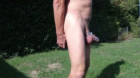 dirty gay slave pig outdoor in peniscage after dildo in ass peeing uncontrolled