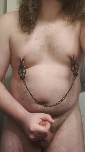 Chubby boy cumming while playing with nipple clamps