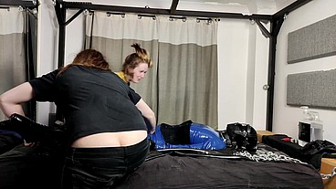 When there's this much bondage, a very warm day and lots of slippery lubed up latex, getting out of it all again is quite the...