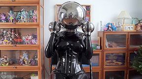 Chick In Latex And Metal And Chastity Belt With Vibrator