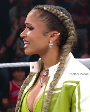Busty celebrity shows off her cleavage in jeans while wrestling