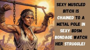 sexy muscled bitch is chained to a metal pole in sexy BDSM bondage watch her struggle