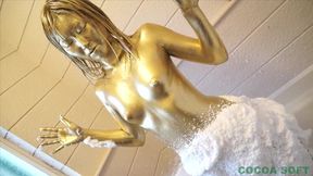Start painting gold paint on the whole body using a brush