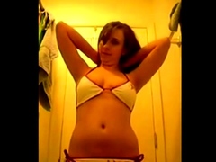 Cute girl records herself trying on bikinis for boyfriend