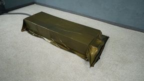 Bondage by boxes in a gold vacuum bed