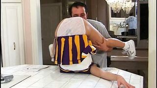 "Gorgeous young cheerleader fucks in the kitchen and gets a mouthful of cum"
