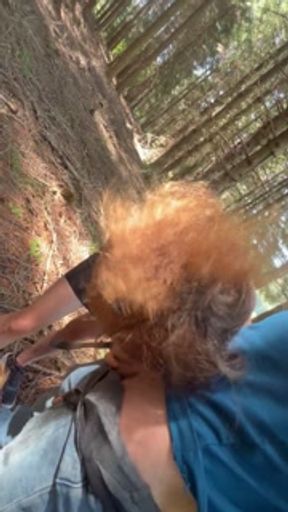 MILF gives a quick blowjob in the forest and swallows cum