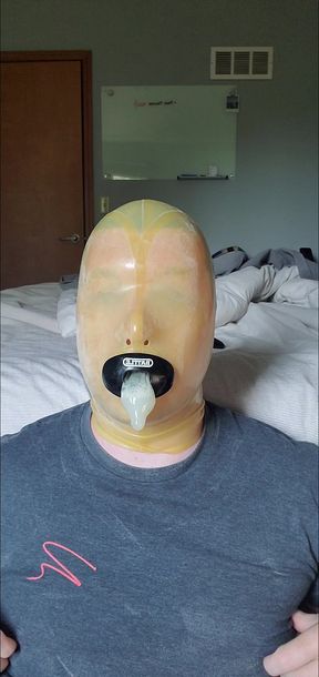 Latex Hooded Slut Swallows Load from Condom
