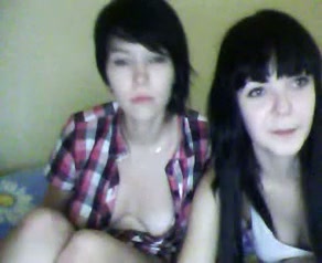 Two naughty dark haired webcam lesbos undress and tease titties