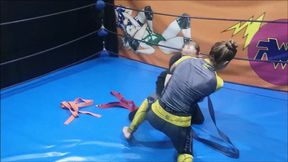 Grappling girl ties up a skinny guy with martial art belts