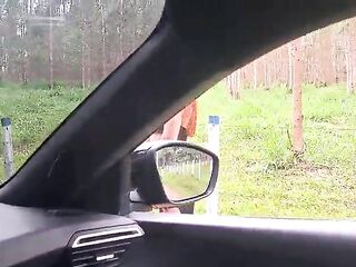 flashing his weenie at a cutie in the car!