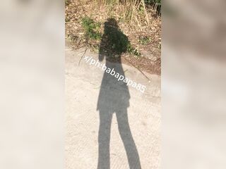 sissy in red bottom high heels and white hollow top exposes herself and pees below highway bridge