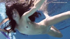 Russian nymphomaniac shows off her tight 18-year-old pussy and tits underwater