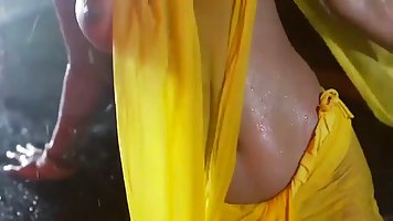 Big titted brunette, Poonam Pandey is taking off her clothes in front of the camera and dancing