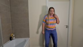 Desperate cutie locked in the bathroom with full bladder pees her jeans