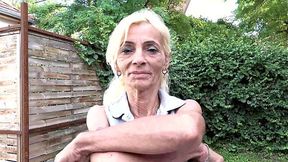 Skinny, toothless milf spreads her slick, pink pussy in public