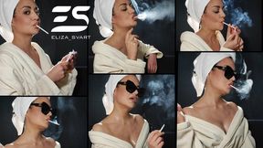 Chainsmoking two Vogue blue slim cigarettes in a bath robe