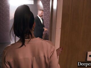 A cigar shop employee is at the service of an exacting customer.