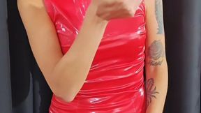 Double Dangle in a tight red shiny dress