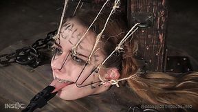 Poor submissive Jessica Kay is put into the wooden barrel and treated hard