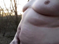 Chubby masturbates in the woods