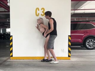 Unknown blonde screws in a parking lot in plain sight