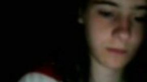 Webcam solo with a brunette teen exposing her natural boobs