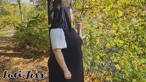 Unholy pregnant nun sneaks a cigarette