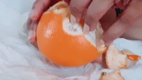 Peeling an Orange with long fingernails