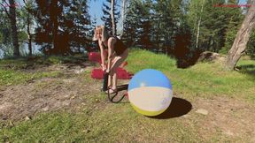 Alla pumps a beach ball with a hand pump and it POPs