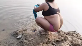 Hot desi sexy girl having fun here with village boyfriend taking bath on river.