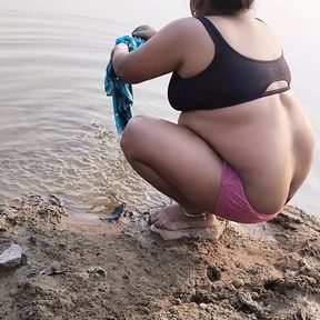 Hot desi sexy girl having fun here with village boyfriend taking bath on river.