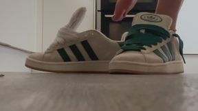 Green sneakers loosely falling off my feet