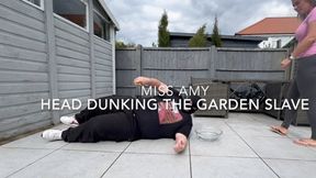 Head Dunking The Garden Slave