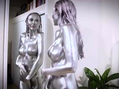 Silver painted milf touching herself in front of a mirror