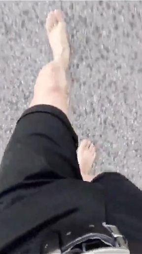 Jon Arteen Walks Barefoot on the Street Outdoors, the Boy Is Barefoot in the Crowded Tram to the Town Center