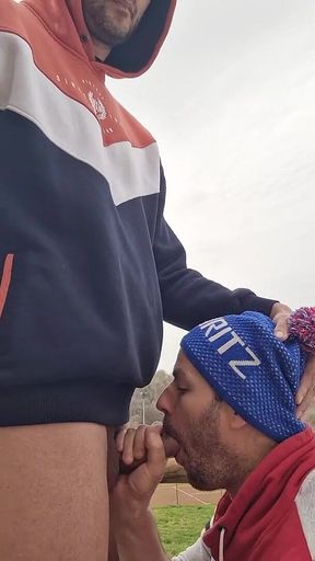 A Guy Gives a Blowjob to a Guy with a Big Cock Outdoors Until He Gives Him a Good Facial