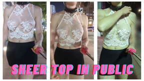 A very public walk with a white see-thru top