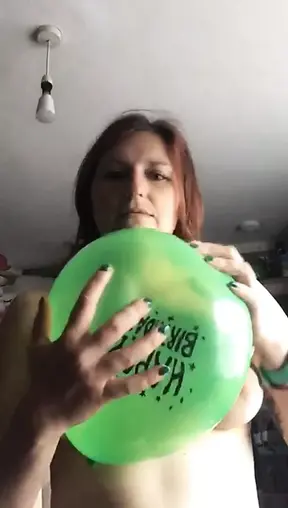 Playing with a balloon and bursting it against my boobs